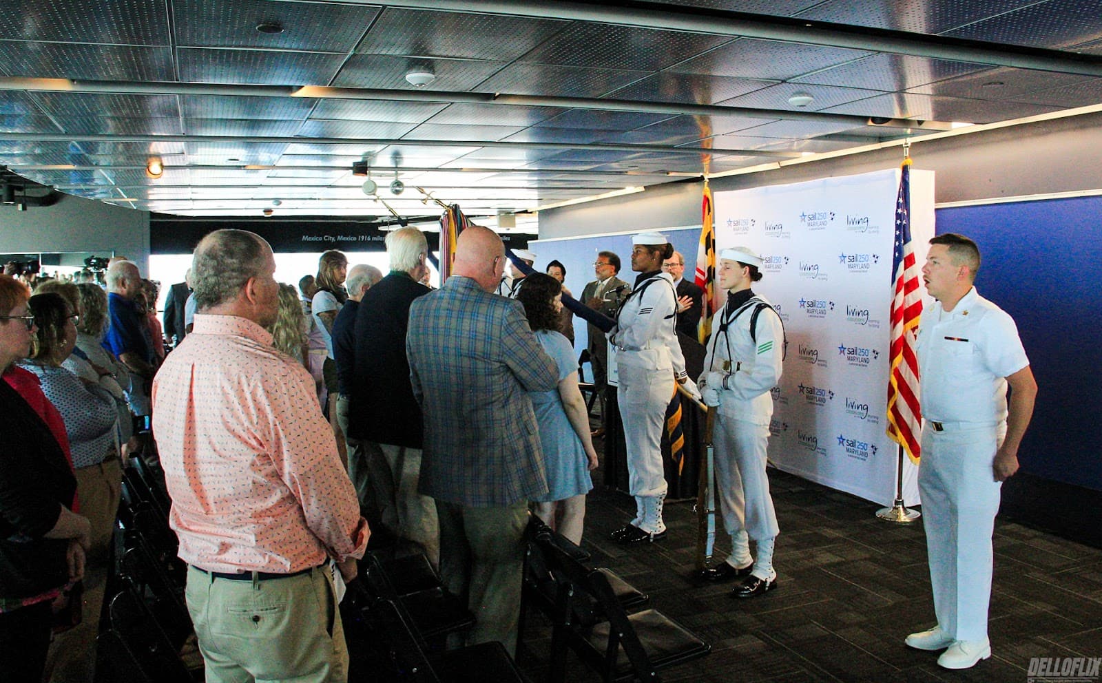 Guests gathered for a ceremony at a waterfront venue