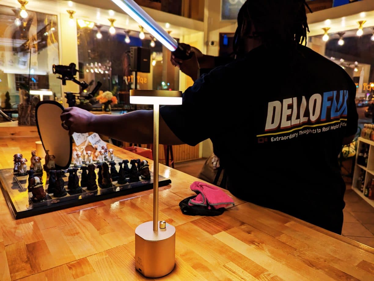 DelloFlix crew member filming a product shot on a gimbal