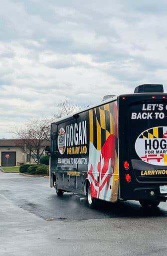 Campaign bus fully wrapped in Maryland flag graphics for Hogan for Maryland